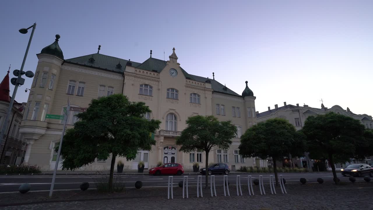 Municipality of Levice town city hall building facade during evening, Slovakia