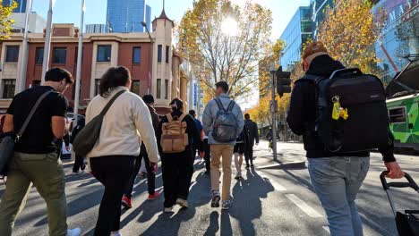 group crossing road in melbourne city