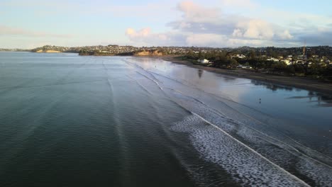 orewa beach at sunset in winter