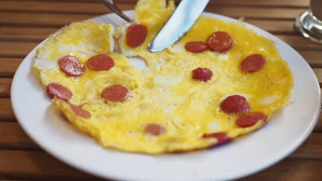 close up of a delicious omelet with sausage