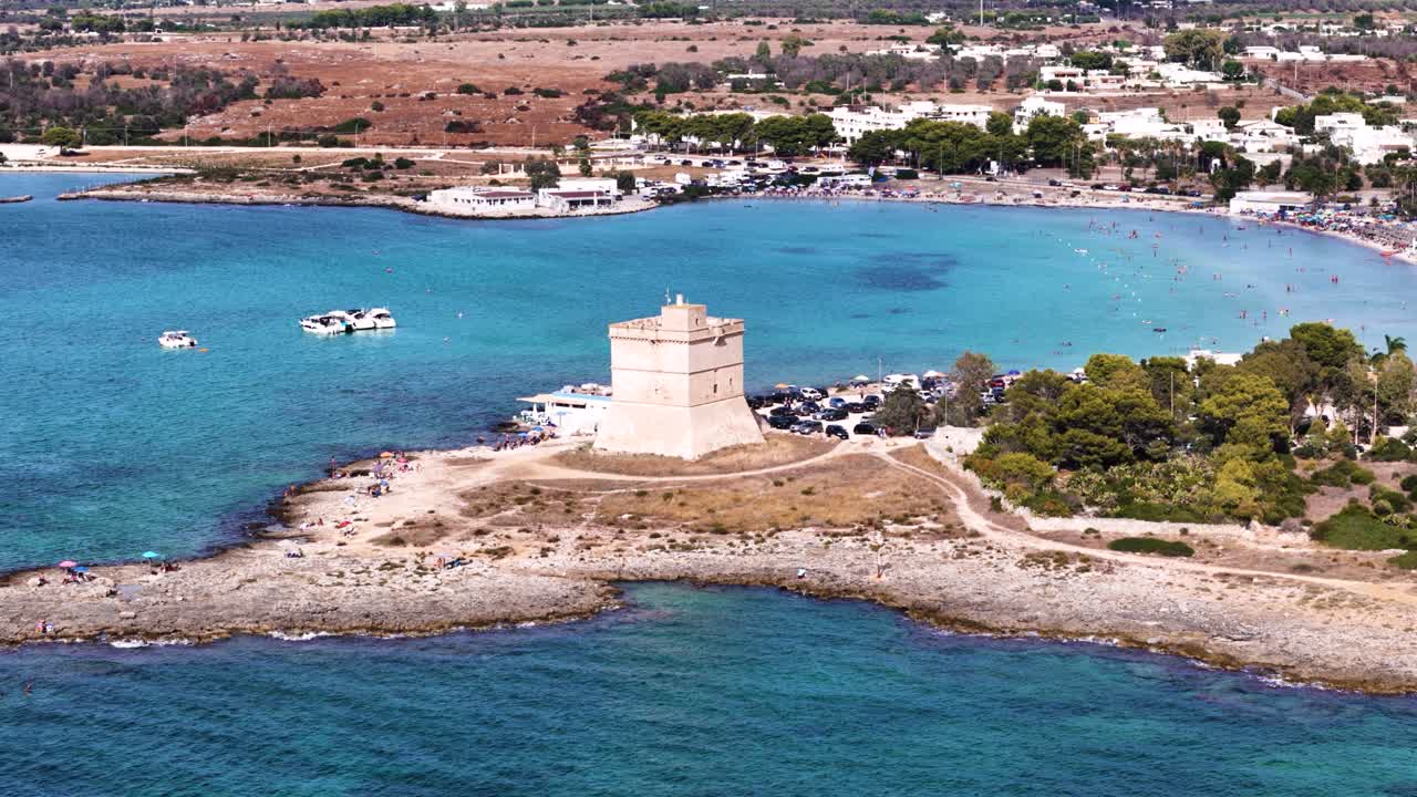 Blue lagoon and medieval castle tower, aerial panoramic view