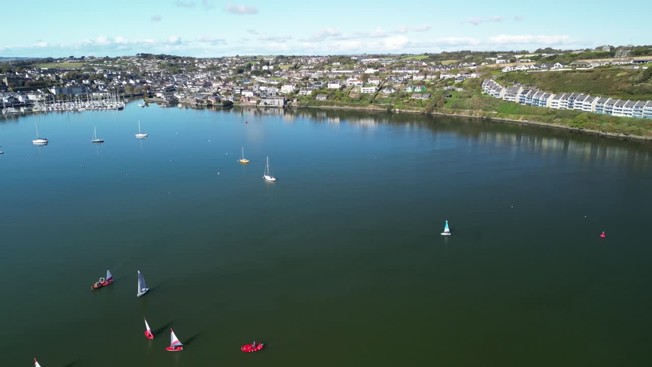 Aerial View of a Coastal Town with Boats in a Calm Bay