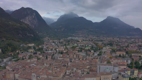 Dolly-out-aerial-shot-of-old,-historic,-Riva-del-Garda-town,-Lombardy,-Italy