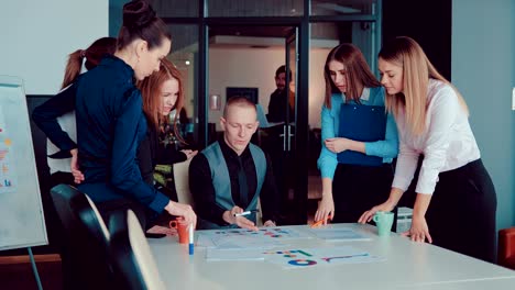 group of business partners on meeting discussing deal at table in the office