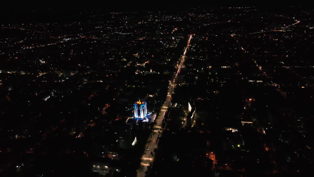 Aerial drone view of Chisinau downtown at night. Parliament, Presidency, road with moving cars and illumination. Moldova