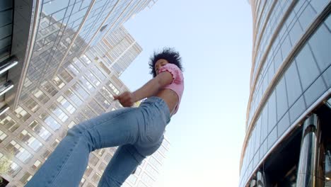 woman dancing in a cityscape
