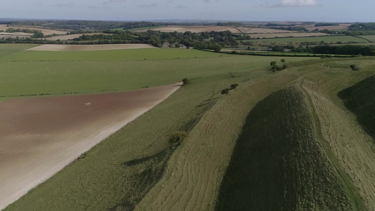 Aerial view of a grassy hill in the countryside