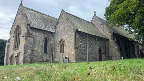 Historic Church and Graveyard in Sunderland with Sunlight Casting Shadows Across Tombstones