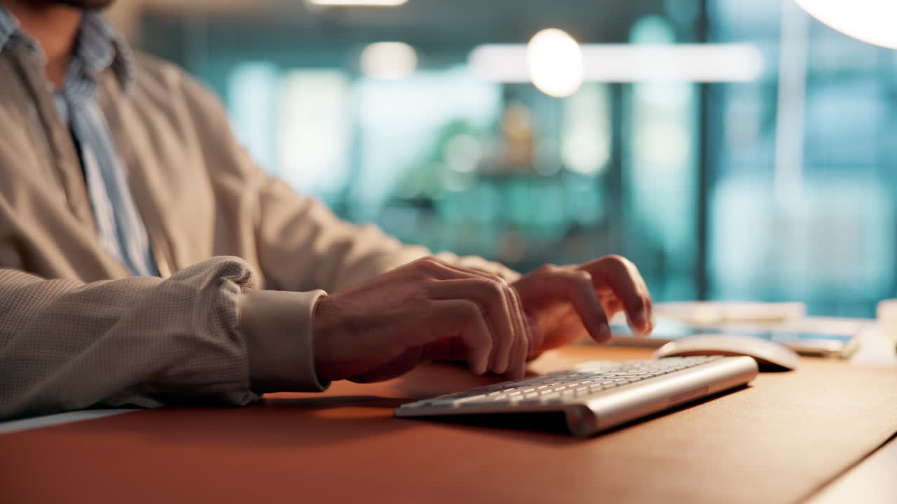 Close Up of Man's Hands Typing on Computer Keyboard