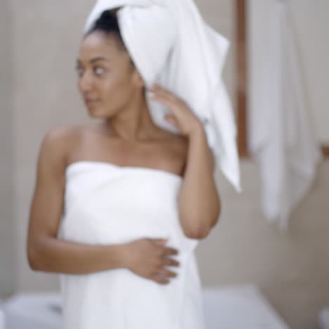 young woman wrapped in towels