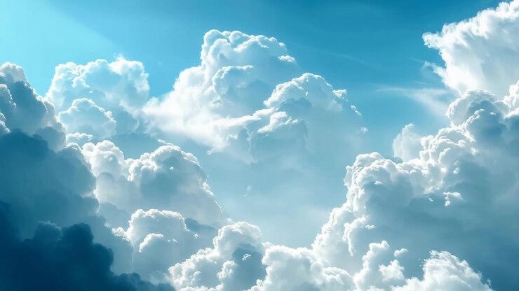 Majestic White Cumulus Clouds in a Bright Blue Sky