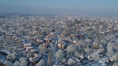 pull back aerial establishing shot of nottingham residential streets during winter