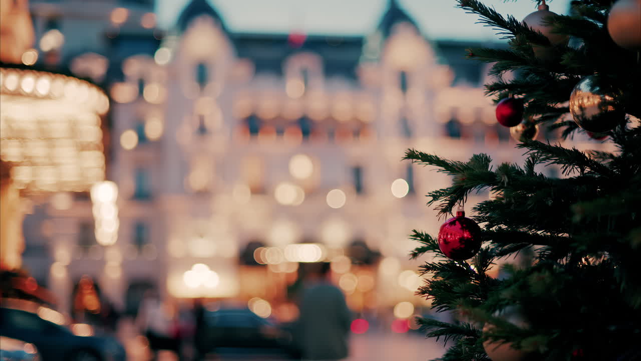 Close up of decorations on a Christmas tree in front of the Monte Carlo Casino in Monaco in the evening