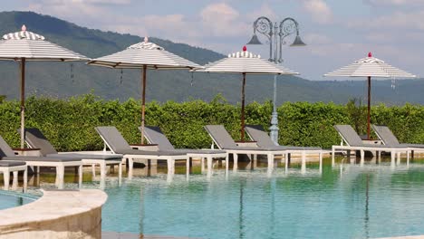 time-lapse of a tranquil poolside setting.