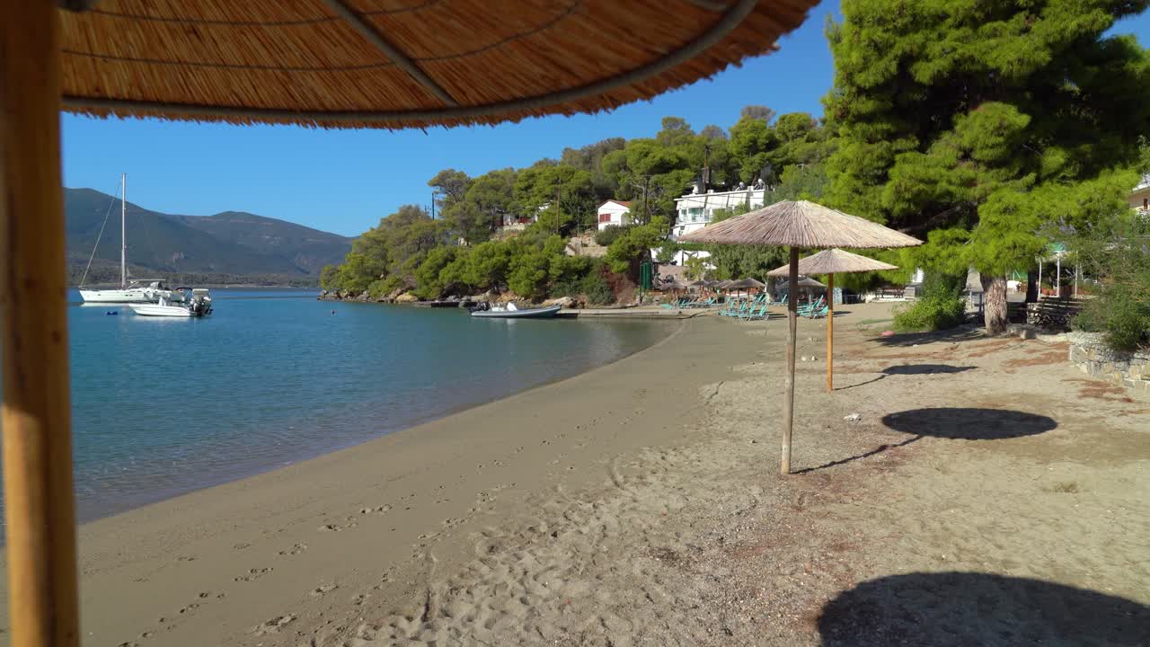 Sun Umbrellas on Neorio Bay anchorage in Poros Island Greece