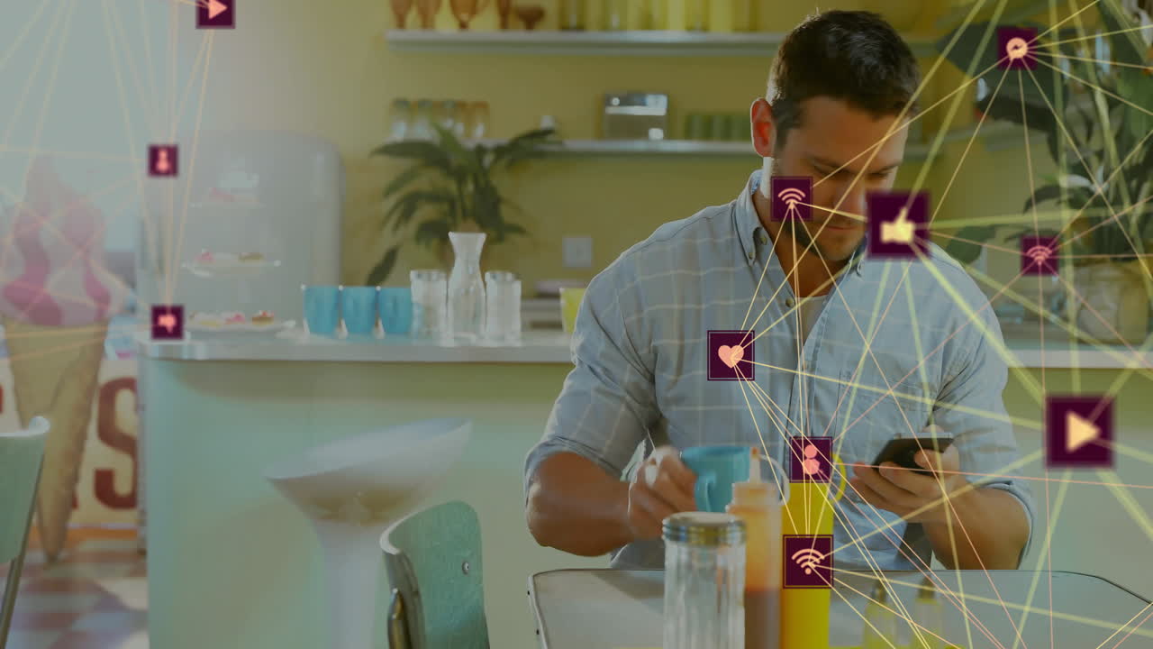 man sipping coffee while checking smartphone in modern kitchen, showing animated tech network icons