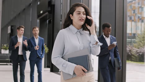beautiful biracial businesswoman having phone call