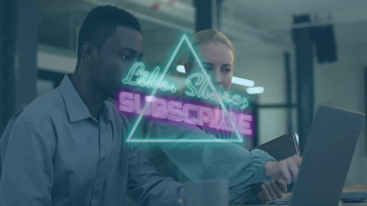Animation of flickering neon subscribe text over diverse business people using laptop