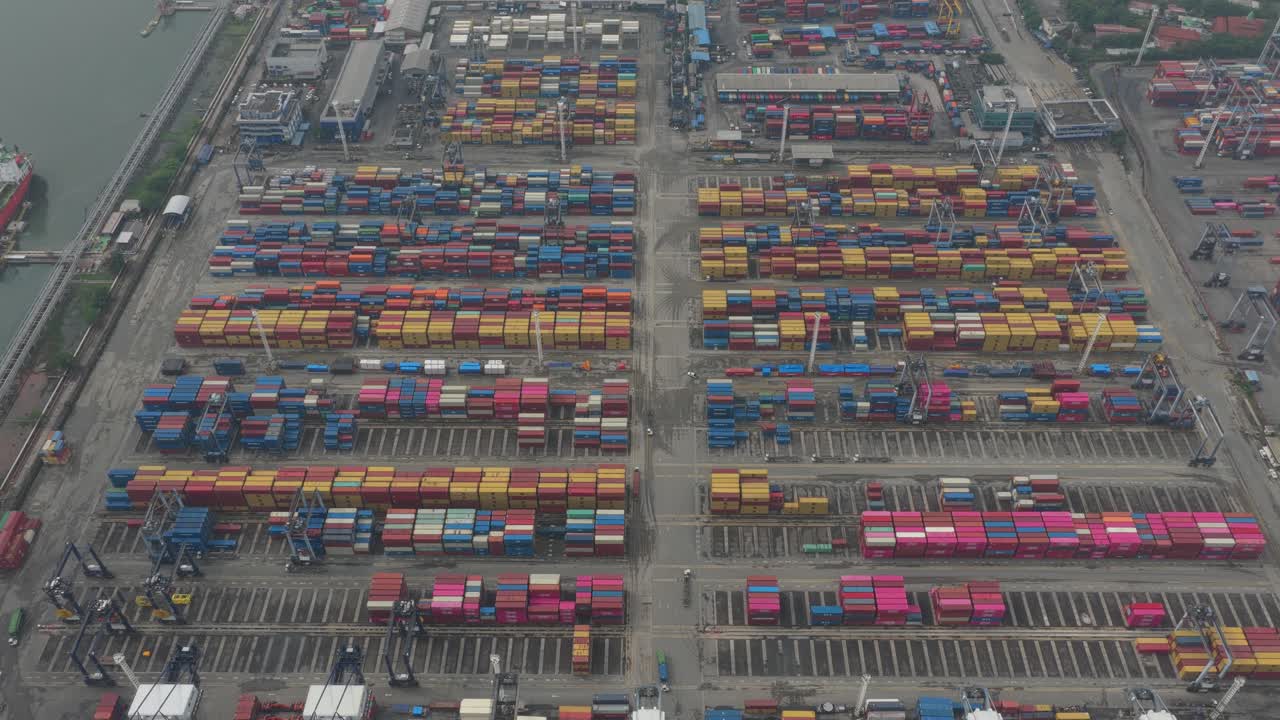 Industrial port in Jakarta featuring cargo containers and shipping traffic