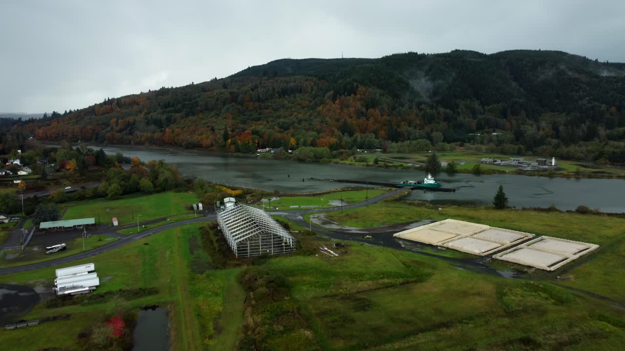 US, WA, Raymond, 2025-10-25 - Drone view of the abandoned train trestle rotating bridge on the Willapa River