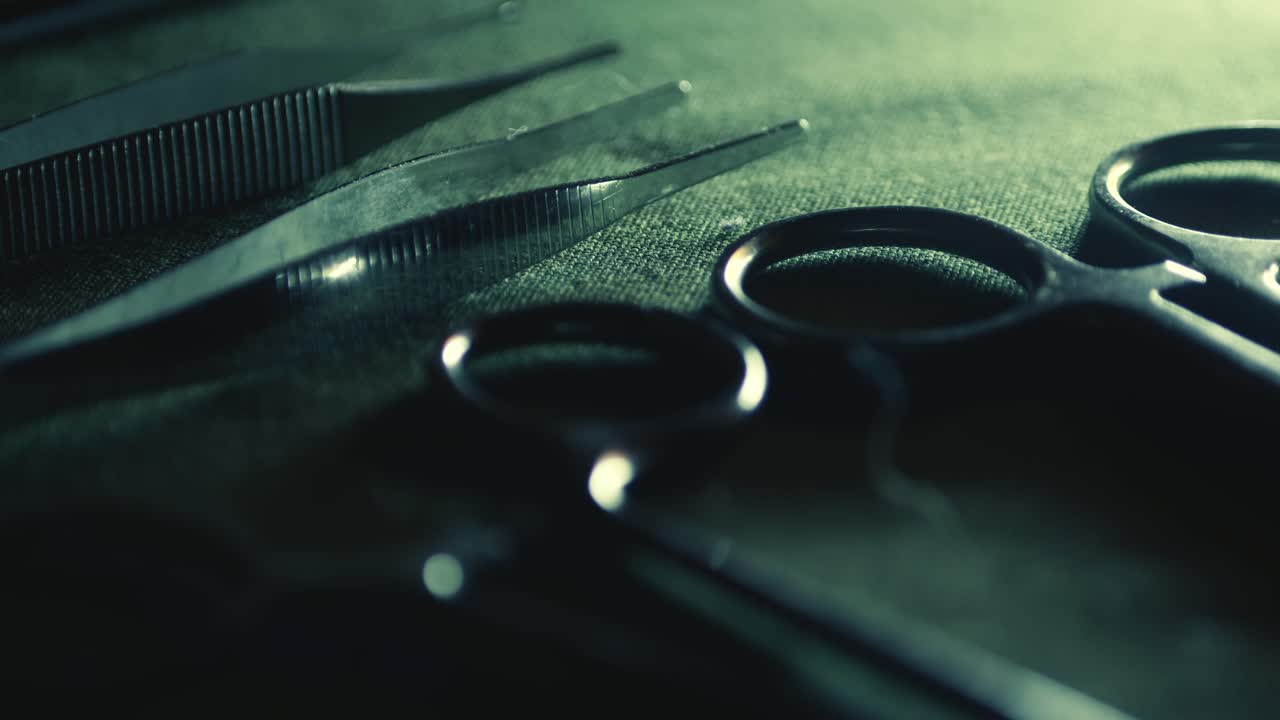 Pull Focus reveals Surgical medical instruments laid out on green linen CLOSE-UP