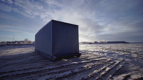 empty container trailer on snowy ground