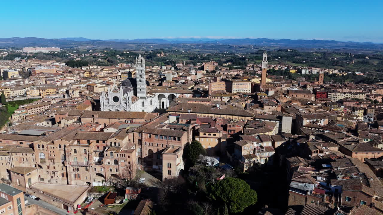 Medieval aerial view of Siena, Italy, with historic buildings and a cathedral