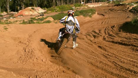 man riding a motor cross bike