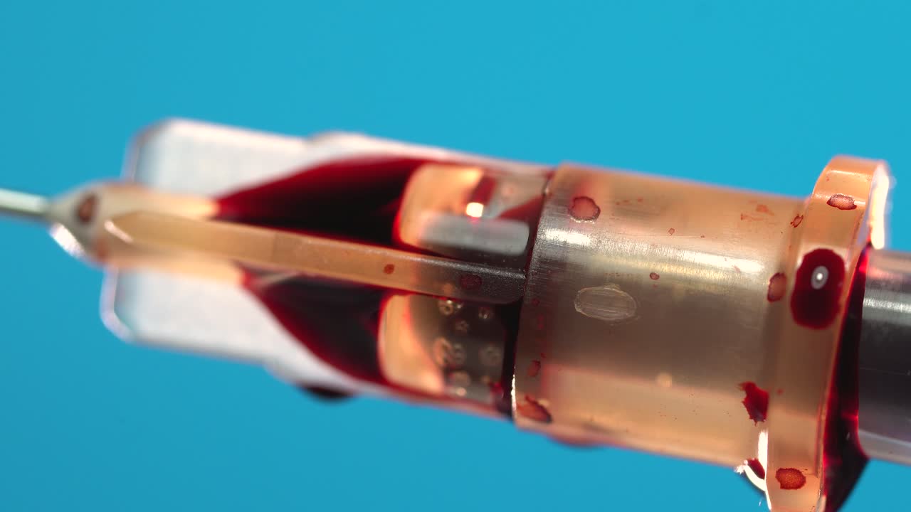 Close-up of a Blood Drop on a Needle