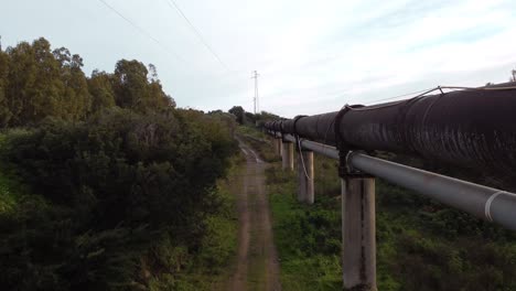 Water-distribution-pipeline-in-Sardinia-Italy,-aerial-drone-in-countryside