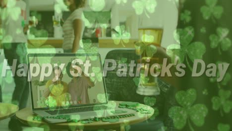 Happy-st-patricks-day-text-and-clover-leaves-against-woman-holding-beer-having-a-video-call-at-a-bar