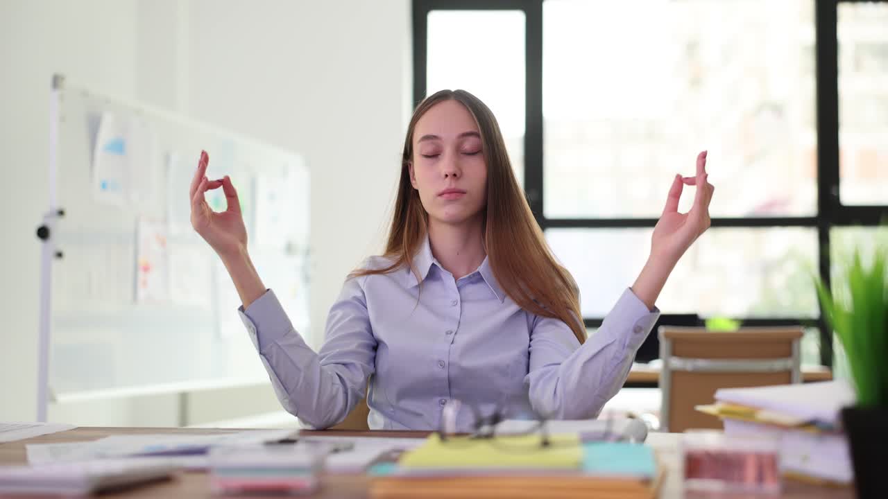 Businesswoman Meditating at Her Desk