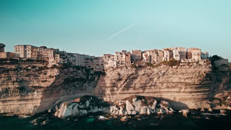 drone-looking-up-to-Bonifacio,-Corsica,-aerial