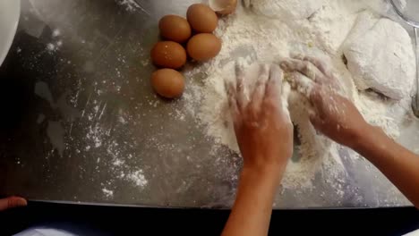 hands of chef preparing cake