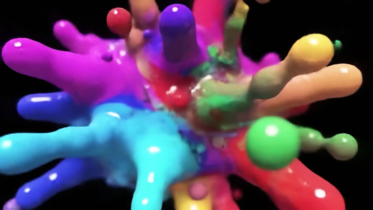 A Vibrant Explosion of Colorful Paint Splashes Captured in Stunning Detail, Showcasing the Dynamic Interaction of Various Shades and Textures in Motion.