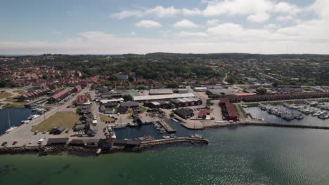 establishing shot drone marina in ebeltoft harbor denmark - panning shot