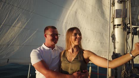 Couple Taking a Selfie on a Sailing Boat at Sunset