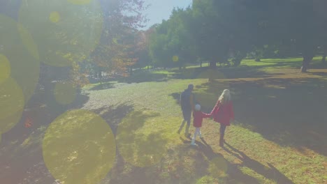 animation of light spots over caucasian family walking together