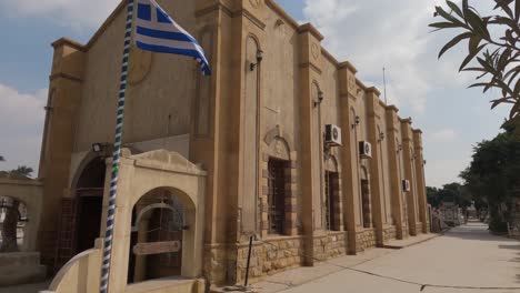 greek flag outside the greek orthodox church of st