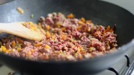 hot minced meat with vegetables cooking in pan