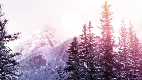 animation of glowing spots of light over snow falling and winter mountain landscape