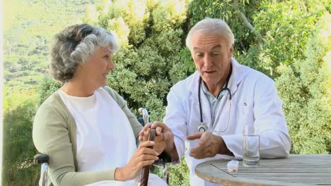 doctor giving bills to a patient