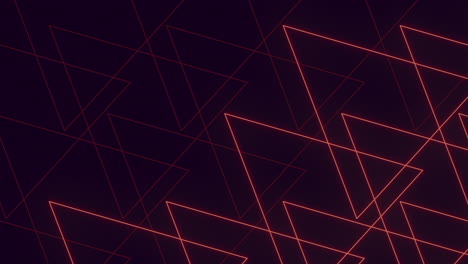 triángulo geométrico rojo radiante sobre un fondo negro