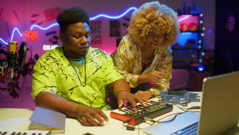music production session in a colorful recording studio