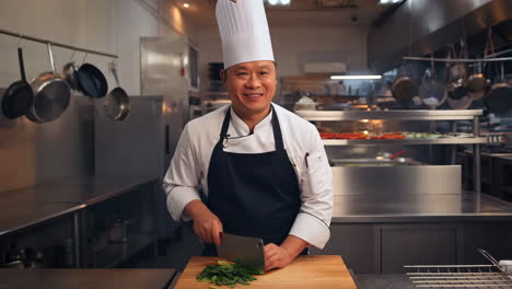 chef cutting vegetables in a professional kitchen