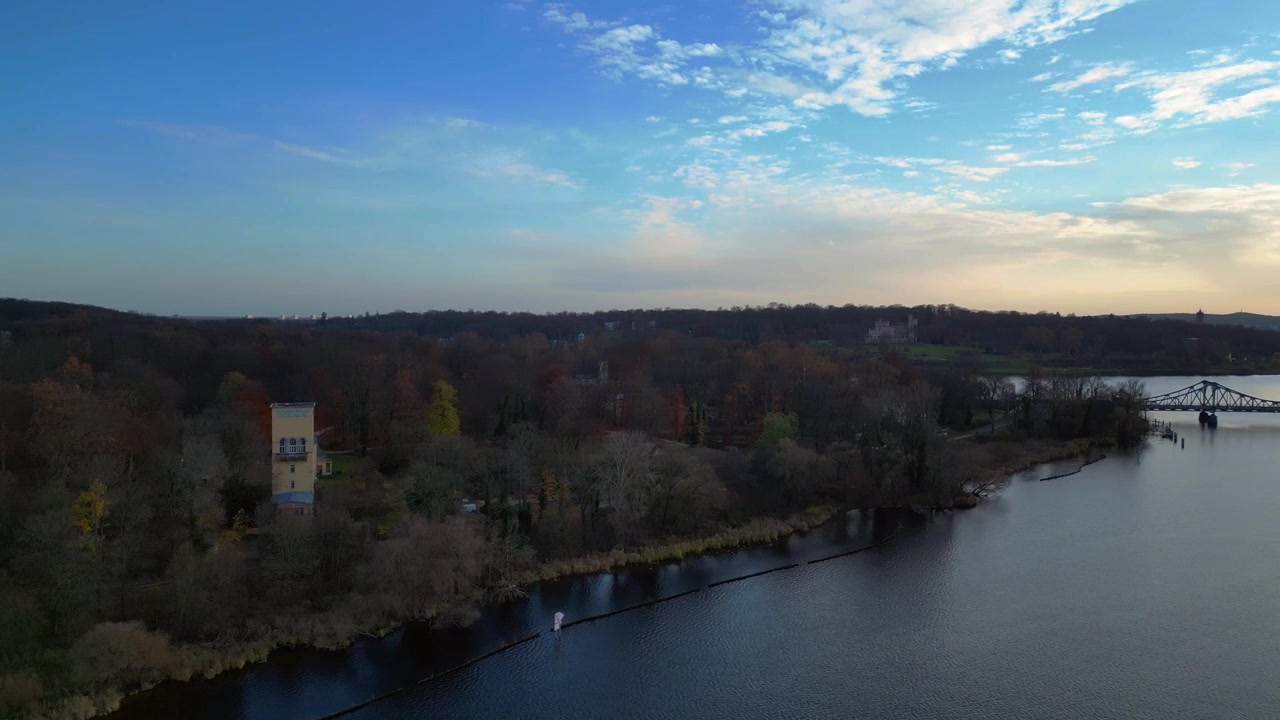 Glienicke Agent bridge in autumn, connecting potsdam and berlin over havel river, germany. Best aerial view flight rotation to right drone