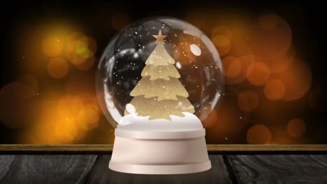 Digital-animation-of-shooting-stars-moving-around-christmas-tree-in-snow-globe-on-wooden-surface-aga