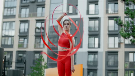 woman performing ribbon dancing outdoors
