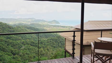 Glamping tent balcony overlooking the mountains with green trees around