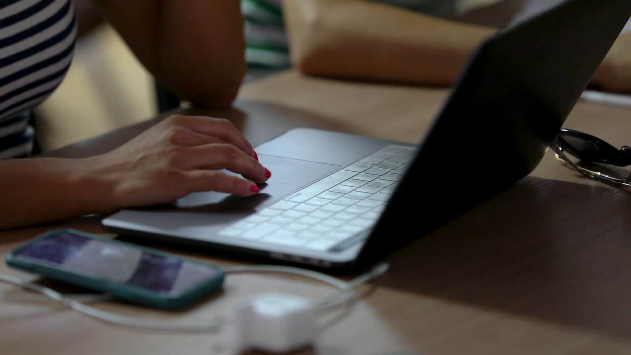 Girl movin fingers on a laptop pad